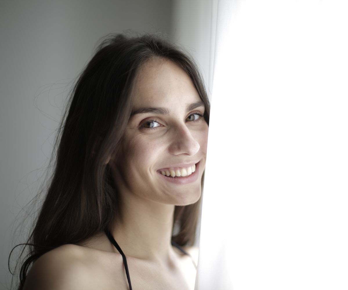 A learner smiling, looking toward what's next